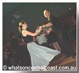 A couple dancing to music of the Shuffle Kings - WhatsOnCentralCoast image