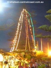 The trees surrounding the parks aglow with the feel of the night. - What's On Image